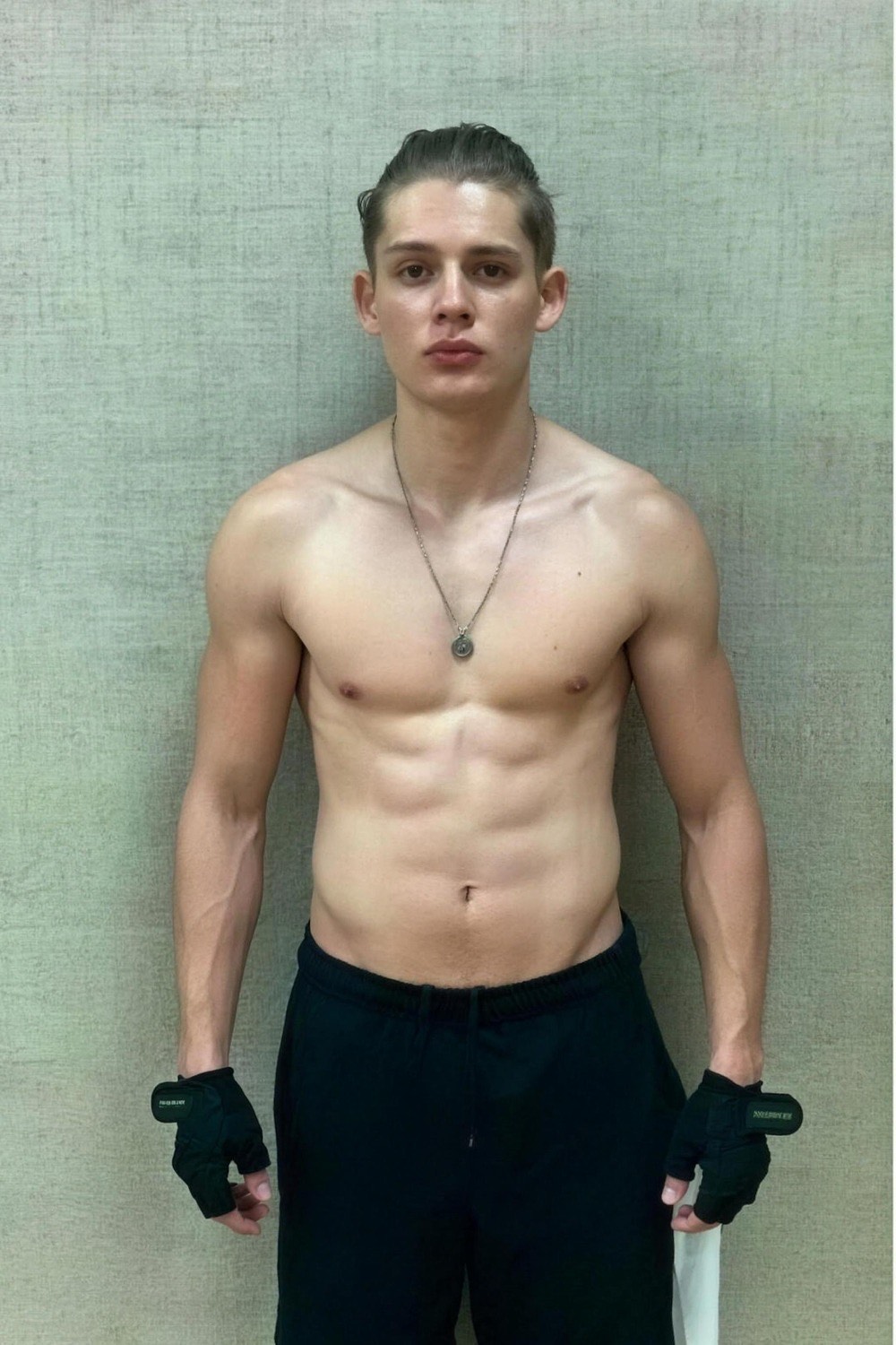 Christian Monik after his first years of training, standing against a plain wall